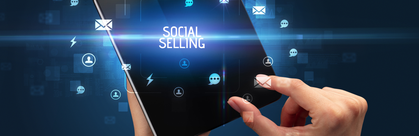 Businessman holding a foldable smartphone with SOCIAL SELLING inscription, social networking concept