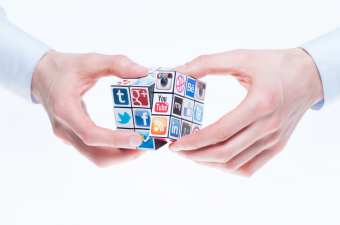 Kiev, Ukraine - February 2, 2013 - A hands holding rubiks cube with logotypes of well-known social media brands. Include Facebook, YouTube, Twitter, Google Plus, Instagram, Vimeo, Flickr, Myspace, Tumblr, Livejournal, Foursquare and other logos.